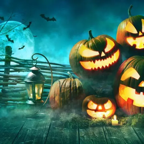 Halloween pumpkin head jack lantern with burning candles